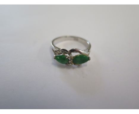 A white metal Jade and Diamond ring marked 811 - ring size K - approx weight 1.7 grams - in good condition 