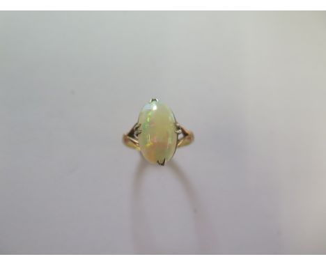 An 18ct yellow gold opal ring size J - approx weight 3 grams - head approx 15mm x 8mm - good condition 