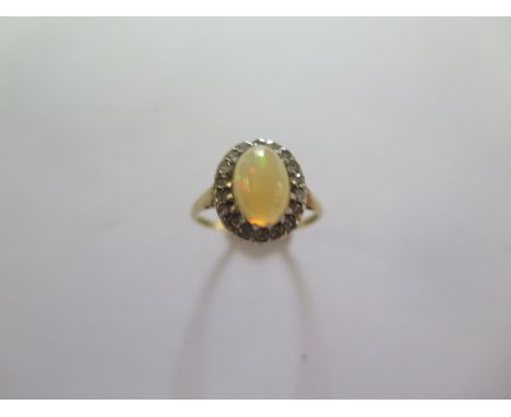 An 18ct yellow gold diamond ring size L/M - approx weight 2.6 grams - head approx 12mm x 10mm - in good condition 