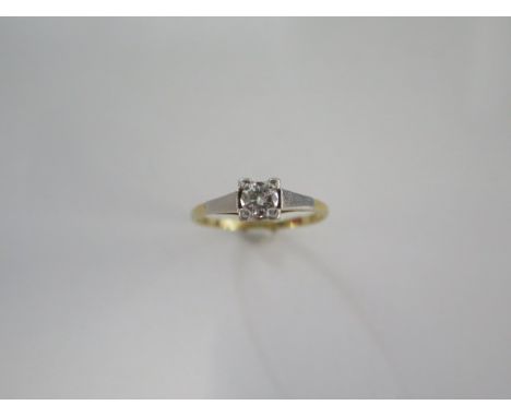 An 18ct yellow gold diamond solitaire ring size O - approx weight 2 grams - diamond bright and lively - diamond weight approx