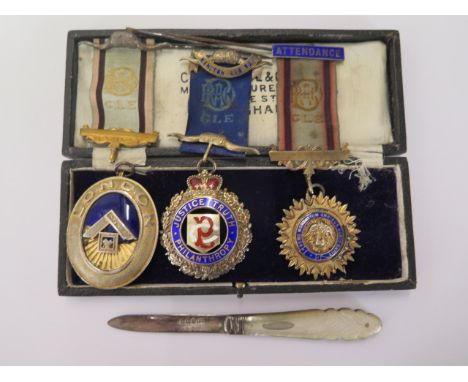 A Masonic silver jewel and two Buffalo silver jewels and a ribbon, Masonic jewel has damage to enamel, others generally good 