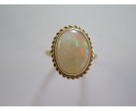 A 9ct yellow gold opal ring size S - approx weight 3.4 grams - head approx 20mm x 15mm - in good condition 