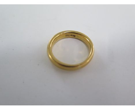 A 22ct yellow gold band ring size N - 4mm wide - approx weight 8 grams 