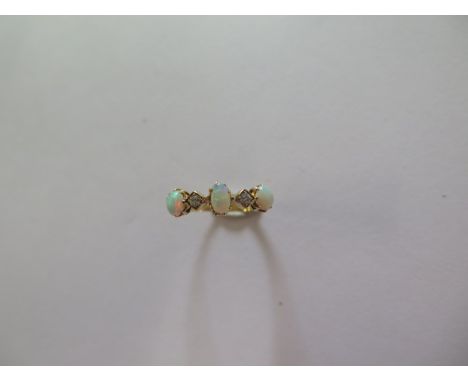 An 18ct yellow gold opal and diamond ring size K/L - approx weight 1.9 grams - in good condition 