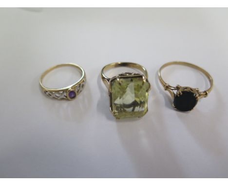 Two 9ct yellow gold rings sizes X and O and a gilt metal ring size N/O - tests to approx 9ct - total weight approx 11.5 grams