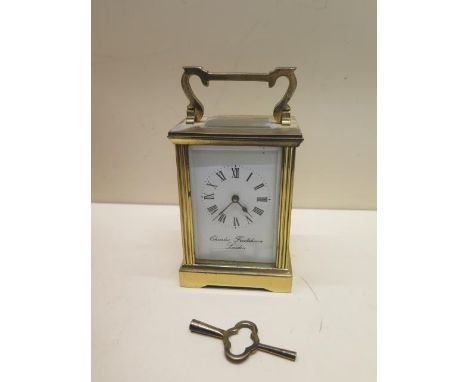 A brass carriage clock - the dial signed Charles Frodsham London - overall 15cm - running, chips to back glass and some wear 