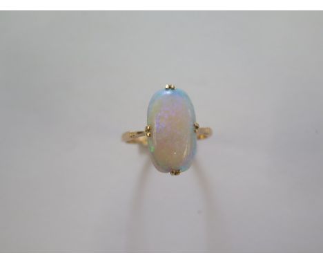 A 9ct yellow gold opal ring size R/S - approx weight 2.9 grams - head approx 18mm x 11mm - in good condition 