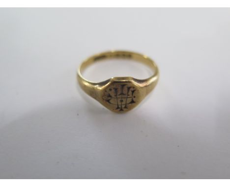 An 18ct yellow gold engraved signet ring size P - approx weight 4.2 grams 