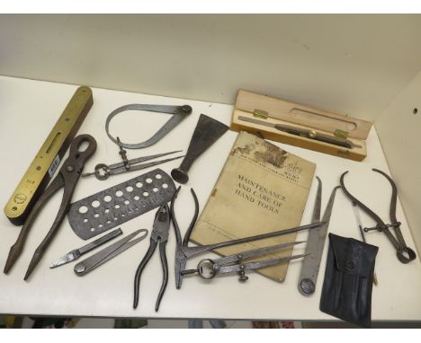 A collection of Military instruments and tools all marked with arrow, also War Dept Handbook tool maintenance 