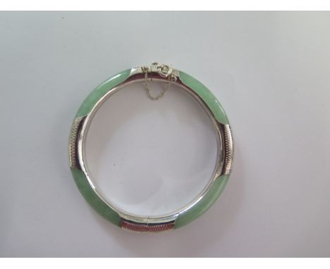 A jade/jadeite and 925 silver hinged bangle - Diameter 7cm - good condition 