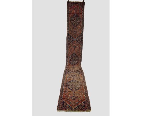 Bijar runner, north west Persia, late 19th century, 15ft. 8in. X 2ft. 4in. 4.77m. X 0.71m. Overall wear with corrosion to bro