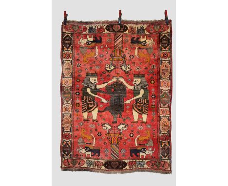 Afshar pictorial rug, Kerman area, south east Persia, circa 1950s,  5ft. 9in. X 4ft. 3in. 1.75m. X 1.30m.  The light red fiel