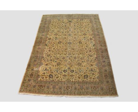 Tabriz carpet, north west Persia, circa 1920s-30s, 13ft. 7in. X 9ft. 8in. 4.14m. X 2.94m. Overall wear with small areas of re