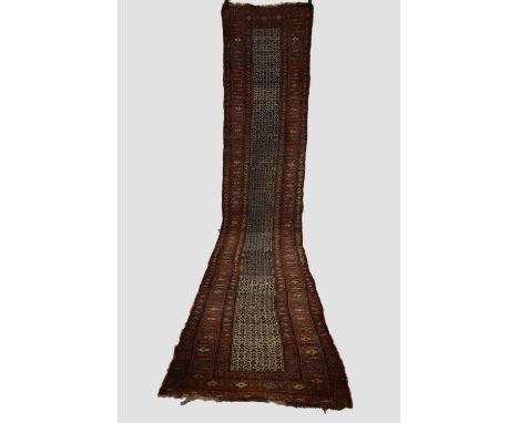 Kurdish runner, (reduced) north west Persia, early 20th century, 16ft. 10in. X 3ft. 3in. 5.13m. X 1m. Overall  wear; some cre