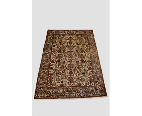 Tabriz carpet with signature, north west Persia, circa 1940s-50s, 10ft. 6in. X 7ft. 2in. 3.20m. X 2.18m.  Some wear in places