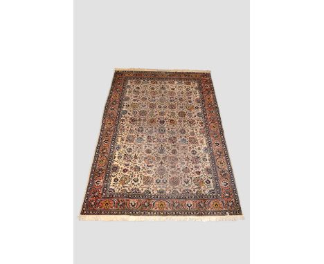 Tabriz carpet with signature, north west Persia, circa 1940s-50s, 11ft. 2in. X 7ft. 9in. 3.40m. X 2.36m. Some wear in places;