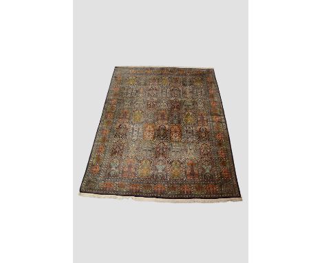 Attractive Kashmiri silk carpet, north India, last quarter 20th century, 10ft. 10in. X 8ft. 3.30m. X 2.44m. Some wear in plac