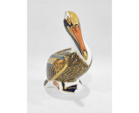 A Royal Crown Derby porcelain Brown Pelican paperweight, printed mark in red to underside and gold button, 13cm high.  (boxed