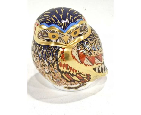 A Royal Crown Derby porcelain Little Owl paperweight, printed mark in red to underside and gold button, 8cm high.  (boxed) 