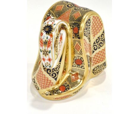 A Royal Crown Derby Old Imari pattern snake paperweight, red printed mark and gold button 8cm high. (boxed)