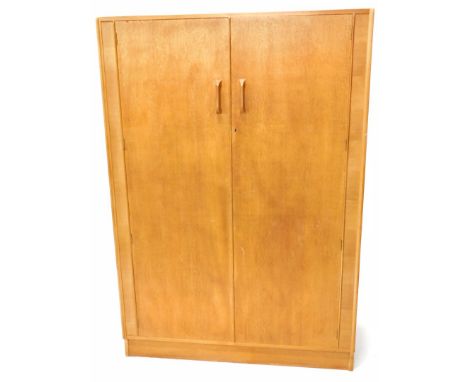 A suite of G Plan light oak furniture, comprising, two door wardrobe, two door wardrobe, four drawer chest of drawers and mat