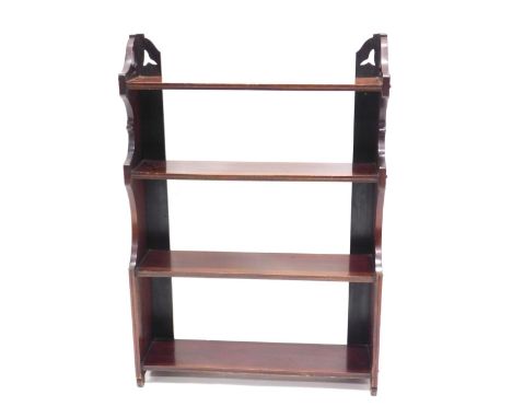 An Edwardian mahogany waterfall wall shelf, with shaped end supports, 89cm high, 62cm wide.