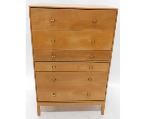 A 1960/70s light oak chest of drawers, of plain form, with six drawers with brass effect handles on plain feet, 119cm high, 7