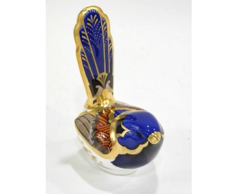 A Royal Crown Derby porcelain Fairy Wren paperweight, printed mark in red to underside and gold button, 7cm high.  (boxed)