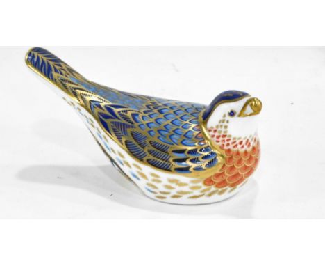 A Royal Crown Derby porcelain Bluebird paperweight, printed mark in red to underside and gold button, 12cm long.  (boxed) 