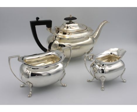 A three piece silver tea serviceWalker &amp; Hall, Sheffield, 1912, of oval bellied form, comprising of teapot 29cm. wide,17c