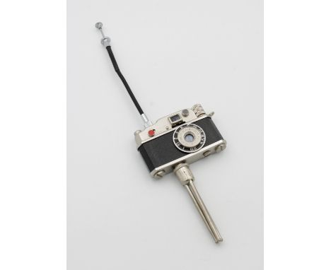 A 1960's Japanese novelty KKW camera lighter and tripodbutane gas model as introduced after 1958 and manufactured until the e