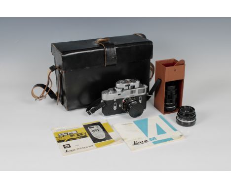 A Leica M4 Rangefinder Cameraserial number ----------, with Leica - Meter MR and three lenses Leitz Wetzlar Summicron 1:2/50,