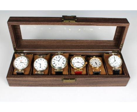 A collection of six modern vintage style collectors watchesin glazed display box, various makers and types.*  Not tested for 