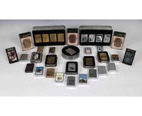 A collection of various Zippo lightersto include a tin boxed set of four 'Charlie Chaplin'; D. Day Normany 50 Years 1944 - 19