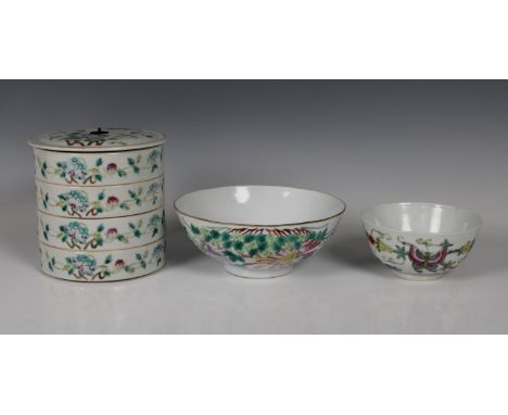A Chinese porcelain four-tier stacking box and coverof typical circular form,13cm. high, together with a famille rose porcela
