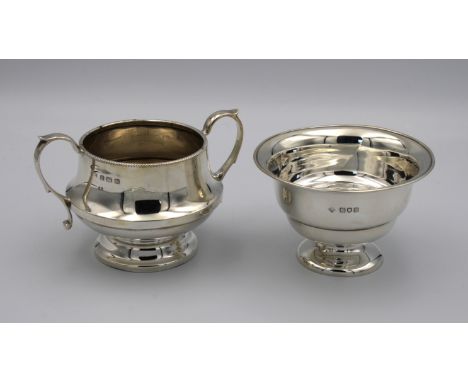 A silver twin handle sugar basinA L Davenport Ltd, of pedestal form, reeded rim, 13.4cm. handle to handle, together with anot