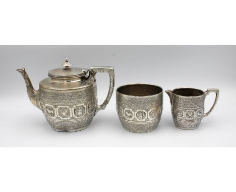 A Scottish silver three piece bachelors tea serviceJames Reid, Glasgow, 1883, comprising of teapot, 13cm. high, sugar basin, 