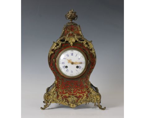 A mid 19th century Boulle style clockwith faux tortoise shell and brass inlay and gilt mounts, a white enamel dial with Roman
