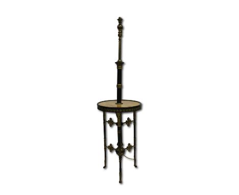 An unusual late 19th century combination oil lamp and side tableformed of a three legged circular marble topped metal table, 