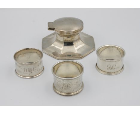 A silver octagonal lidded inkwell with glass linerweighted, marks rubbed, 9cm. wide, 4.5cm. high, together with three silver 