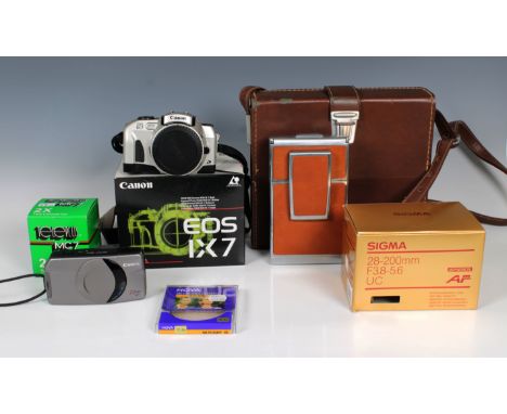 A cased Polaroid SX-20 Land Camera in leather casetogether with Canon EOS IX7; Sigma 28-200mm F3.8-5.6 UC lens, etc.