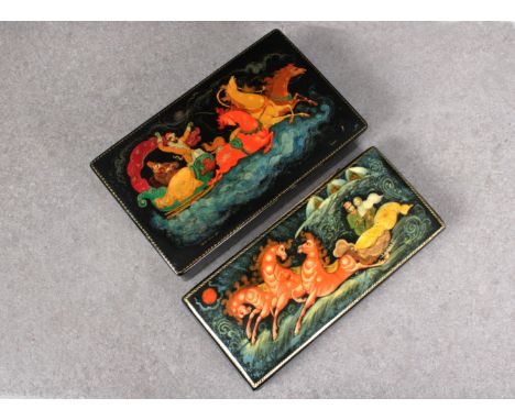 Two 20th century Russian Lacquered boxesof rectangular form, both with hinged covers, depicting troika, the deeper probably o