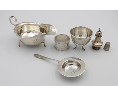 A collection of silverincluding an Edwardian silver sauce boat, maker's mark for 'Barker Brothers', Chester 1915; a silver te