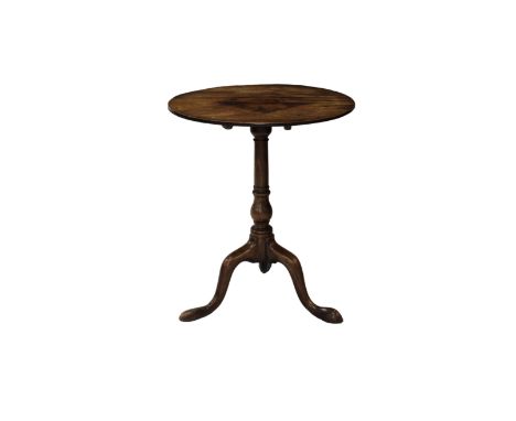 A late Georgian mahogany tripod table with a circular topand turned pedestal raised on three cabriole legs, 57cm. diameter, 6