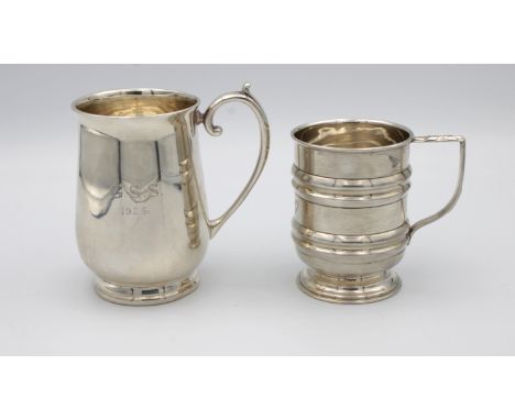 A George V silver baluster christening mugof plain polished form, scroll handles, spreading circular foot, monogrammed and da