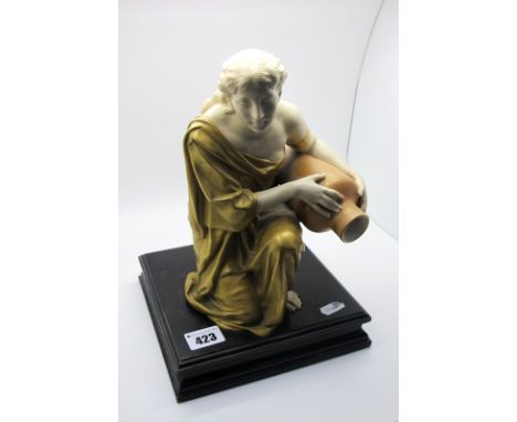 A Royal Worcester Porcelain Figure of a Water Carrier, the kneeling lady in a gilt flowing robe holding a large urn, printed 