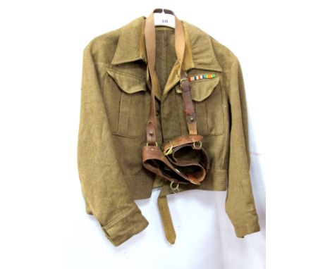 A British WWII Era 1937 Pattern Khaki Army Tunic, wear to cuffs, buttons and collar; plus a leather Sam Brown, both named to 