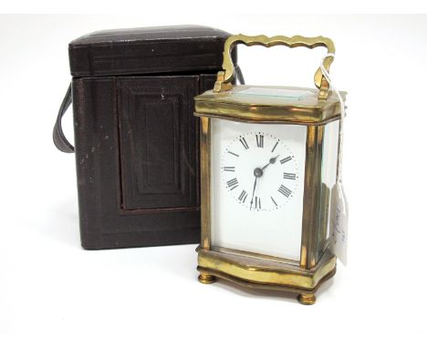An Early XX Century Brass Carriage Clock, the white enamel face with Roman numerals, the movement stamped "Sf R A", in a fitt