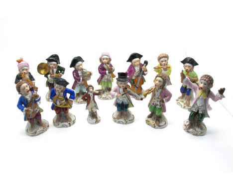 A Sitzendorf Porcelain Early XX Century Twelve Piece Monkey Band, including conductor, violinist, piper etc. all raised on sc