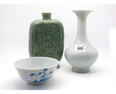 An Early XX Century Pale Celadon Chinese Pottery Vase, of baluster form with moulded foliate and scroll decoration, 20cm high